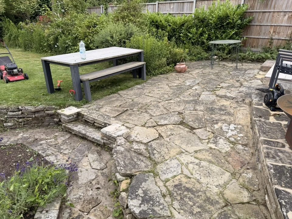 After: the same patio cleared and swept clean